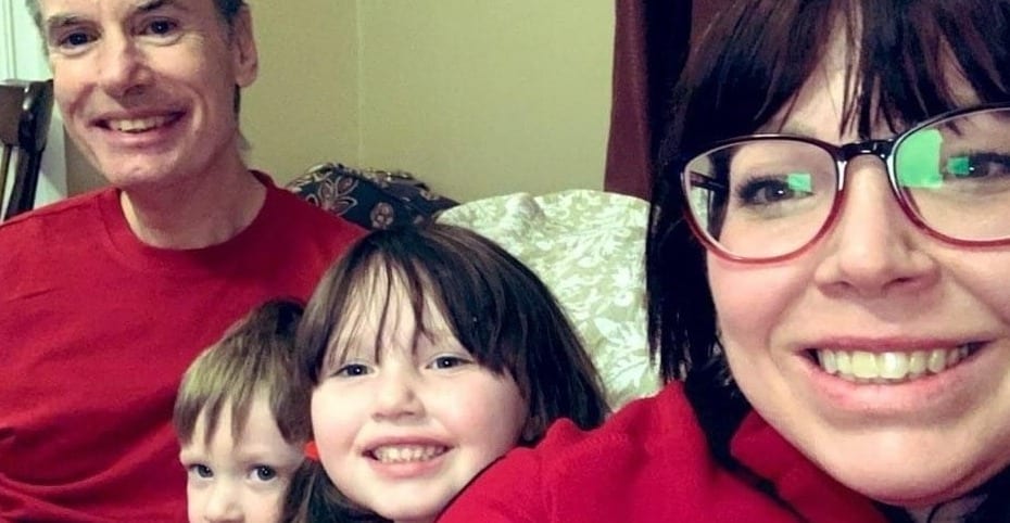 Family wearing matching red outfits.