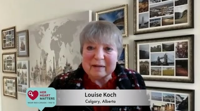 Person in front of framed pictures.