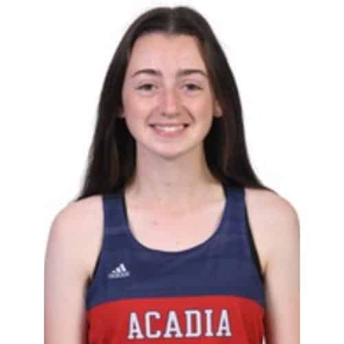 Athlete wearing Acadia sports jersey.