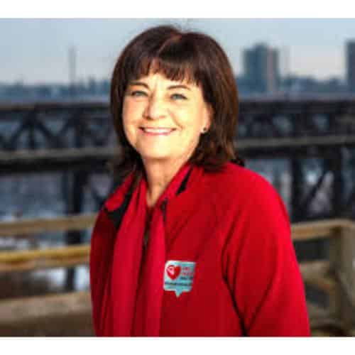Person in red jacket outdoors.
