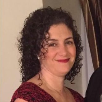 Woman in red dress, curly hair.