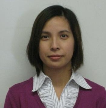 Person with short hair, wearing sweater.