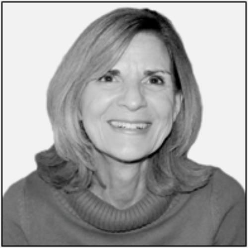 Woman with shoulder-length hair, smiling.