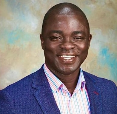 Man in a blue blazer portrait.