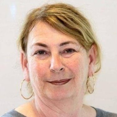 Woman with earrings and blonde hair.